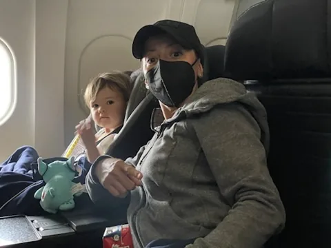 Marie and Zoe sitting together on an airplane