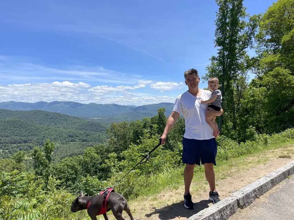 Andrew holding Zoe with Francis at a Blue Ridge mountain overlook