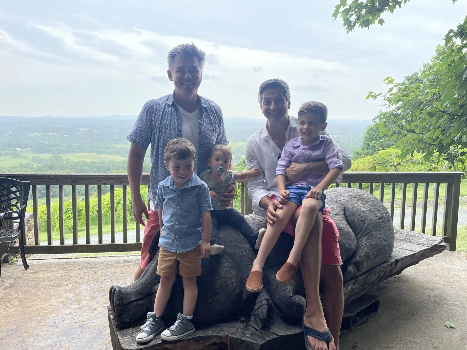 Andrew, Zoe, and family sitting by a Virginia overlook