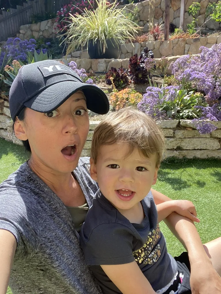 Marie and Zoe smiling in a sunny garden