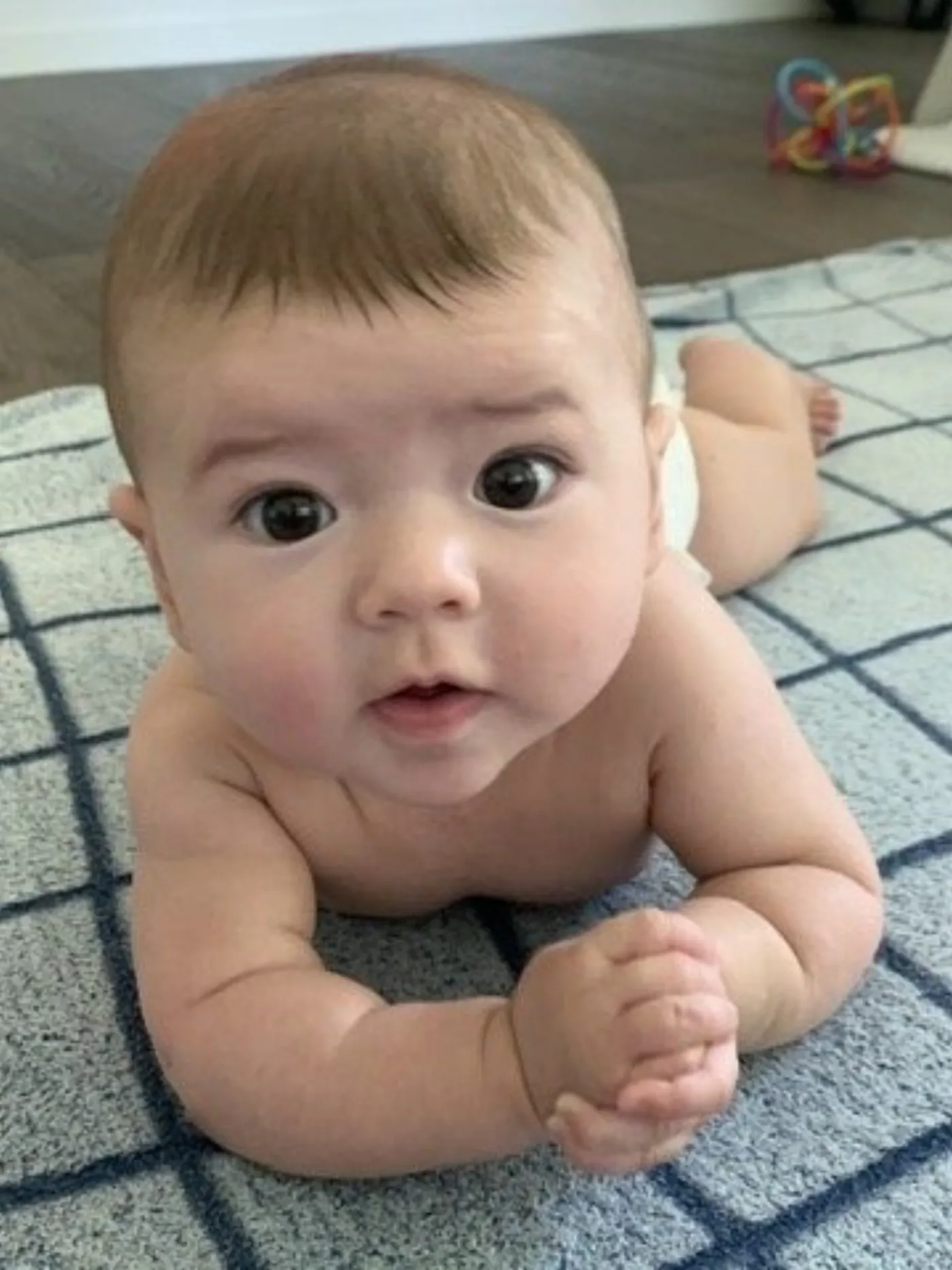 Zoe propped up on her elbows during tummy time